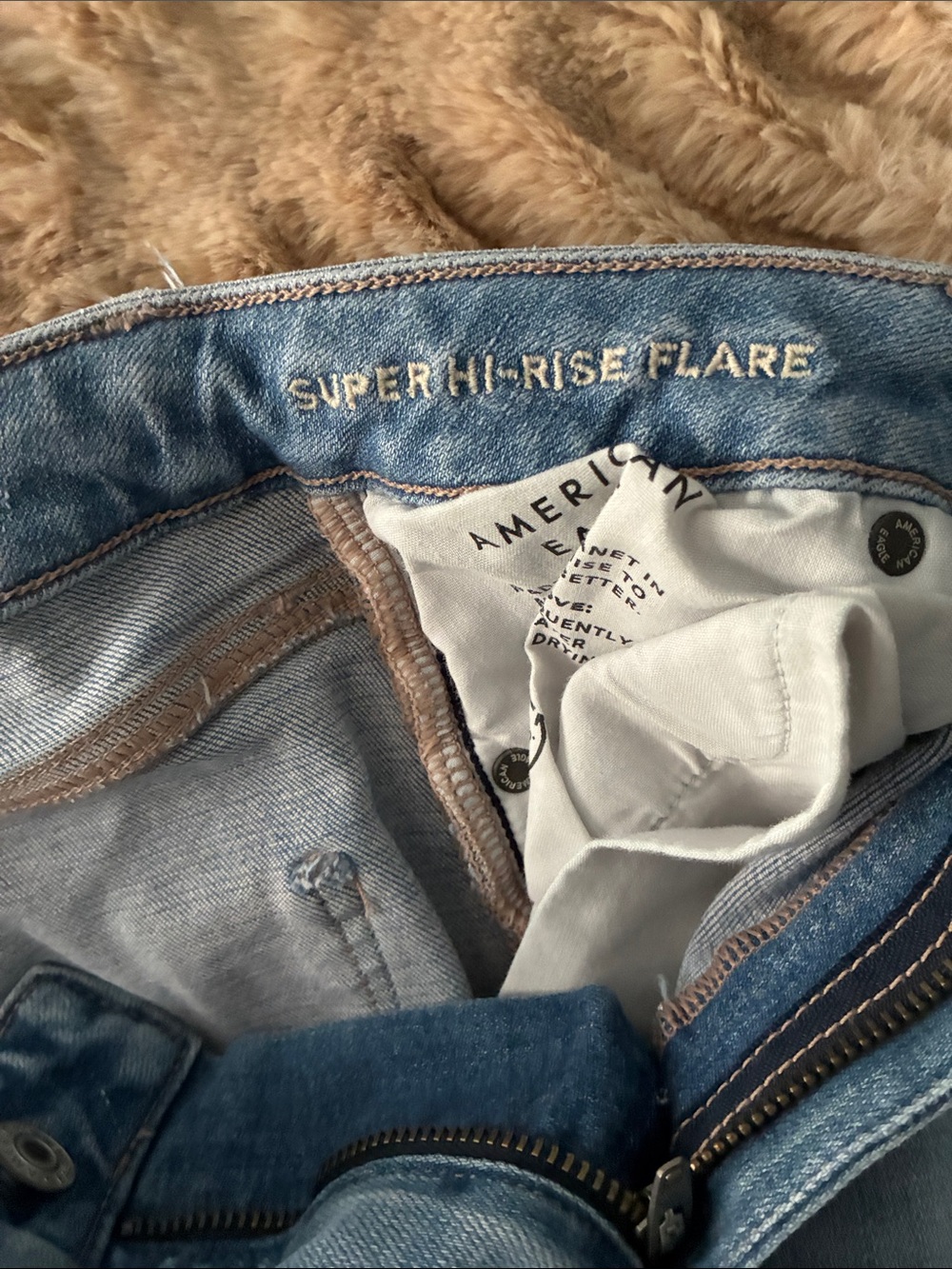 AE Light Wash Distressed Flare Jeans - Women - Picture 12 of 12